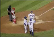  ?? JULIE JACOBSON — THE ASSOCIATED PRESS ?? New York Met outfielder Michael Conforto (30) is greeted at home plate by Curtis Granderson (3) and Kelly Johnson following his three-run homer in the fifth inning against the Phillies on Friday.