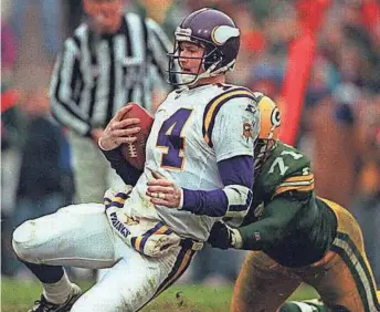  ?? PACKER PLUS FILES ?? Vikings QB Brad Johnson is sacked by Packers defensive lineman Santana Dotson during the second quarter of their game Dec. 22, 1996.