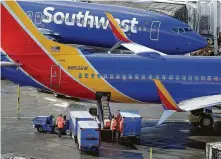  ?? Ted S. Warren / Associated Press ?? Southwest crews count bags they load and use an average weight to calculate the load, a method with which the FAA takes issue.