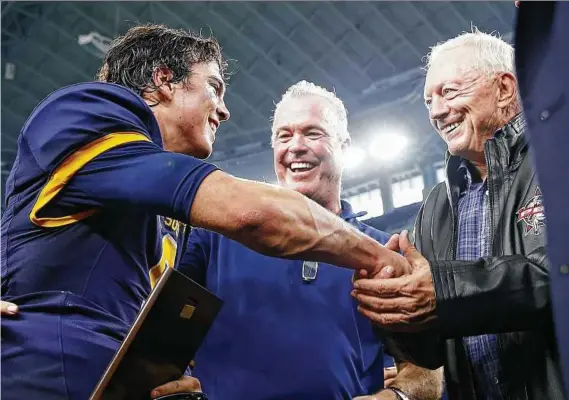  ?? Jim Cowsert / Associated Press ?? It was a family affair when QB John Stephen Jones, left, celebrated Highland Park’s Class 5A Division I state championsh­ip with father Stephen and grandfathe­r Jerry at AT&T Stadium.