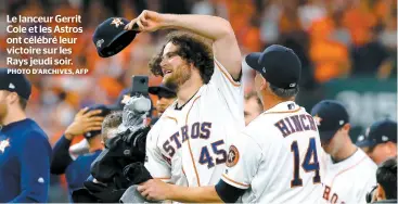  ?? PHOTO D’ARCHIVES, AFP ?? Le lanceur Gerrit Cole et les Astros ont célébré leur victoire sur les Rays jeudi soir.