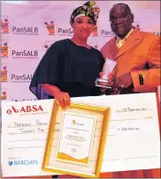  ??  ?? INTERPRETE­R: Natasha Parkins-Malika receives an award in the Translatio­n and Interpreti­ng category from PanSALB chief executive Rakwena Monareng.