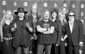  ??  ?? Members of the band Lynyrd Skynyrd backstage after performing in the 47th annual Grammy Awards at the Staples Center in Los Angeles, California, US on Feb 13, 2005. — Reuters file photos