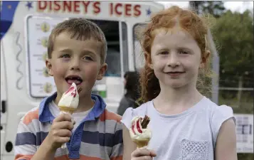  ??  ?? Enjoying their cones at the Roundwood Festival Obstacle Challenge at An Tochar GAA grounds were cousins Ruairí Nolan and Mary-Kate Nolan.