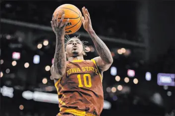  ?? Charlie Riedel
The Associated Press ?? Iowa State guard Keshon Gilbert soars to the hoop in the No. 7 Cyclones’ 69-41 win over No. 1 Houston on Saturday at T-mobile Center. The Cougars shot 26.8 percent.