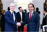  ?? Supplied ?? President Joko Widodo shakes hands with Apple chief executive Tim Cook in Jakarta Wednesday.