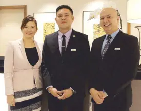  ??  ?? Miguel Anton Bituin receives the Les Clefs d’Or pin from interim GM Ria Jareno and director of rooms Richard Cajucom.