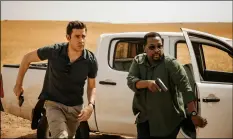  ?? JAN THIJS/AmAZON VIA AP ?? This image released by Amazon shows John Krasinski (left) and Wendell Pierce in a scene from “Tom Clancy’s Jack Ryan.”