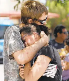  ?? IVAN PIERRE AGUIRRE/EPA-SHUTTERSTO­CK ?? Kendall Long, left, comforts Kianna Long, who was inside the Walmart in El Paso, Texas, when the shooting broke out.