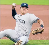  ?? GREGORYBUL­L/AP ?? Gio Urshela makes a throw from the ground to make a play at first base for an out during Monday’s Game 1 of the ALDS.