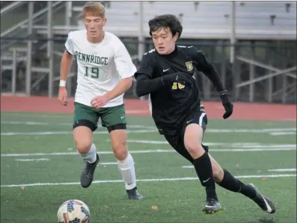  ?? GENE WALSH — DIGITAL FIRST MEDIA ?? CB West’s Jimi Leder chases down a pass near Pennridge’s Aidan Link.