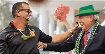  ?? MIAMI HERALD ?? UM benefactor Alex Rodriguez, a guest on ESPN’s “College GameDay” show, and analyst Lee Corso react after making their picks to win Miami vs. Notre Dame. Corso said his choice of the Fighting Irish was “strictly business.”