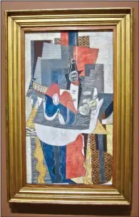  ?? ?? Georges Braque’s “Guitar and Bottle of Marc on a Table” is shown at Arkansas Museum of Fine Arts.