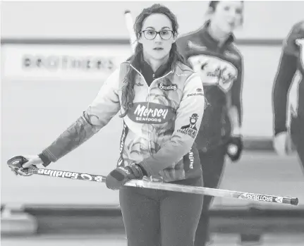  ?? TIM KROCHAK • CHRONICLE HERALD ?? Jill Brothers is seen during action against Theresa Breen at the Nova Scotia Scotties Tournament of Hearts at the Dartmouth Curling Club in January.