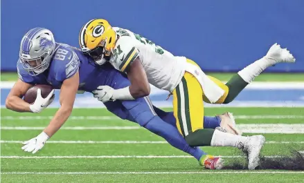  ?? GETTY IMAGES ?? Adrian Amos brings down Lions receiver T.J. Hockenson for one of his seven tackles Sunday.