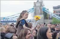  ?? AP PHOTO ?? People attend a vigil for victims of Saturday’s attack in London Bridge, at Potter’ Field Park in London, Monday.