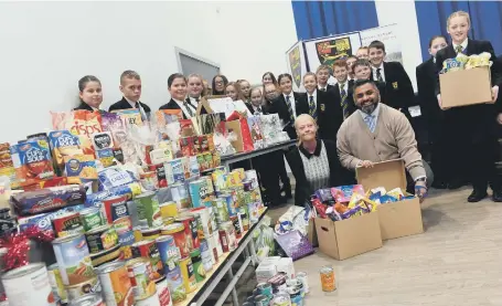  ??  ?? Teacher’s Amran Suleman and Christine Sanderson with pupils from Hetton School.