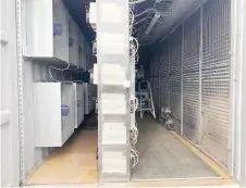  ??  ?? In this photo recieved by AFP, a smartbox with an open door shows Bitmain miners deployed in the EZ Smartbox Mobile data center in Utah.