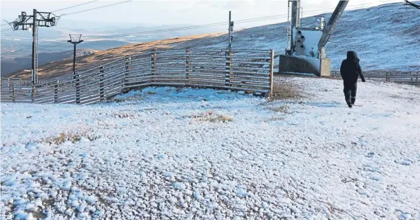  ??  ?? FROSTED: Cairn Gorm mountain where there was a dusting of snow yesterday in an early autumn fall, boosting the country’s biggest winter sports location