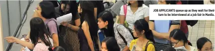  ??  ?? JOB APPLICANTS queue up as they wait for their turn to be interviewe­d at a job fair in Manila.