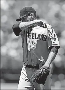  ?? PRESS] [BEN MARGOT/THE ASSOCIATED ?? Indians reliever Dan Otero wipes his face as he is removed in the third inning against Oakland. Otero came on in the first in place of struggling Trevor Bauer.