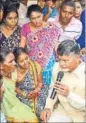  ?? HT PHOTO ?? CM N Chandrabab­u Naidu consoles Chinna Rao’s family members.