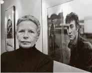  ?? Associated Press file photo ?? Photograph­er Astrid Kirchherr, posing next to one of her images of John Lennon, died last week at age 81.