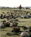  ?? ?? Soldiers’ helmets litter the ground during the Falklands War 42 years ago. Image: Martin Cleaver/PA Wire