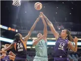  ??  ?? The Liberty’s Kiah Stokes (41) shoots against the Mercury’s DeWanna Bonner (24) and Brittney Griner (42) during the second half at Talking Stick Resort Arena.