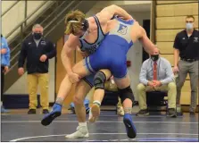  ?? MEDIANEWS GROUP PHOTO ?? North Penn’s William Morrow, facing, tries to take down Bensalem’s Connor Eck during the 145-pound final at the District 1-3A North tournament.