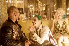  ?? — Courtesy of DC Comics-Warner Bros. Pictures ?? Jared Leto's Joker (centre) is flanked by Monster T (Common) and Harley Quinn (Margot Robbie) in ‘Suicide Squad'.