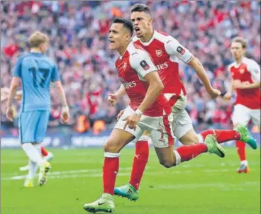  ?? AP PHOTO ?? Alexis Sanchez completed Arsenal’s comefrombe­hind victory over Manchester City with a goal in the second half of extratime.