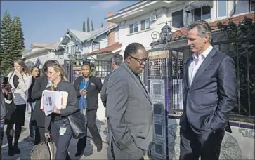  ?? Francine Orr Los Angeles Times ?? COUNCILMAN Mark Ridley-Thomas, center, with Gov. Gavin Newsom. Ridley-Thomas faces federal charges that he took bribes from a USC dean in exchange for directing funding to the school as a county supervisor.