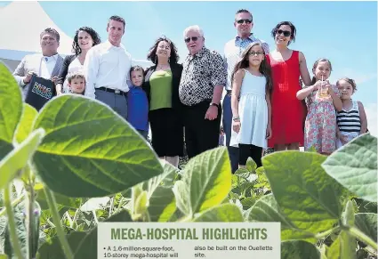  ?? JASON KRYK/The Windsor Star ?? Windsor Regional Hospital CEO David Musyj joins the O’Keefe family for a portrait on their farm at County Road 42 and 9th Concession, which will be the home for the new
regional mega-hospital.