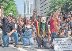  ?? GETTY IMAGES/AFP ?? Demonstrat­ors outside Bank of America Stadium before an NFL football game in Charlotte, North Carolina