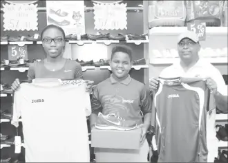  ?? (Orlando Charles photo) ?? Colours Boutique yesterday continued its associatio­n with table tennis prodigy Kaysan Ninvalle by presenting him with a set of gear. The Caribbean 11 and Under Champion departs this evening for the Caribbean Pre and Mini Cadet Table Tennis...