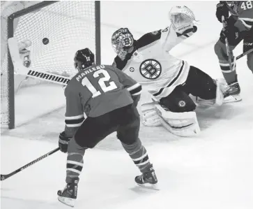  ?? NHAT V. MEYER/STAFF ?? The Sharks’ Patrick Marleau scores against Bruins goalie Tuukka Rask for the 502nd goal of his NHL career.