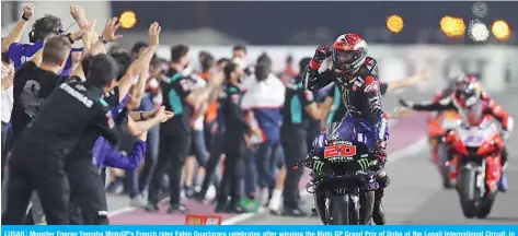  ?? — AFP ?? LUSAIL: Monster Energy Yamaha MotoGP’s French rider Fabio Quartararo celebrates after winning the Moto GP Grand Prix of Doha at the Losail Internatio­nal Circuit, in the city of Lusail on Sunday.