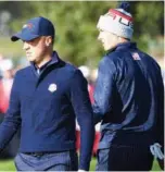  ?? Reuters / Agence France-presse ?? From left: Team Europe’s Tommy Fleetwood (left) and team-mate Francesco Molinari celebrate during their foursomes match of the Ryder Cup against the US pair of Justin Thomas and Jordan Spieth at Le Golf National in Guyancourt, France, on Saturday. Team US’S Justin Thomas (left) and team-mate Jordan Spieth seen during their fourball match against Team Europe’s Ian Poulter and Jon Rahmon on the second day.