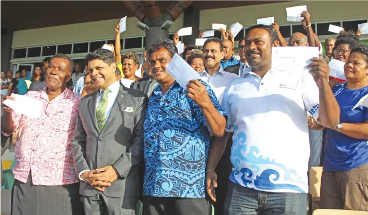  ?? Photo: Simione Haravanua ?? Taxi Permit receipient­s with the Acting Prime Minister and Attorney General, Aiyaz Sayed-Khaiyum after the handing over ceremony on May 21,2018.