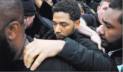  ?? Kamil Krzaczynsk­i The Associated Press ?? “Empire” actor Jussie Smollett leaves Cook County jail Thursday following his release in Chicago.