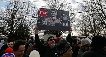  ??  ?? No to Trump: Anti-trump demonstrat­ors holding up signs outside Grumman Studios before a campaign rally for trump in Bethpage, long island, New york. — EpA