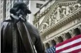  ?? BEBETO MATTHEWS — THE ASSOCIATED PRESS FILE ?? Federal Hall’s George Washington statue stands near the flag-covered pillars of the New York Stock Exchange. Stocks around the world plunged Friday as investors feared that a trade conflict between the U.S. and China, the biggest economies in the...