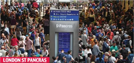  ??  ?? Hot and bothered: Crowds gather after Eurostar services were hit by power line problems in Paris LONDON ST PANCRAS