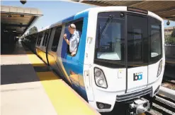  ??  ?? One of BART’s new trains makes a stop at South Hayward Station. The new cars are being assembled by Bombardier in Plattsburg­h, N.Y.