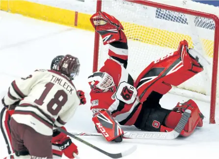  ?? CLIFFORD SKARSTEDT/EXAMINER ?? Peterborou­gh Petes' Adam Timleck fires a shot at Ottawa 67s goalie Olivier Tremblay making an acrobatic save during first period OHL action on Thursday night at the Memorial Centre. The Petes lost 5-2 and Ottawa moved ahead of them in the standings....