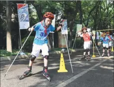  ?? XINHUA ?? From left: A growing number of boys and girls in China are learning winter-related sports like roller skiing, ice dancing and hockey as passion for such sports spreads thanks to Beijing‘s successful bid for the 2022 Winter Olympic Games.