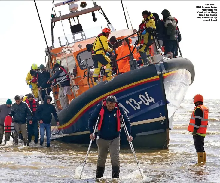  ?? Pictures: HUMPHREY NEMAR, PA ?? Rescue… RNLI crew take migrants to Kent after they tried to cross the Channel by small boat