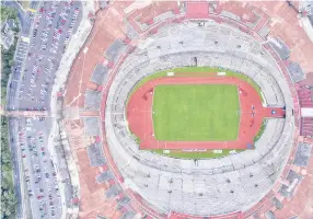  ?? — AFP photo ?? Aereal view of the Olimpico Universita­rio stadium, owned by the National Autonomous University of Mexico (UNAM), and which hosted the 1968 Summer Olympics, in Mexico City, on October 10, 2018.
