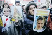  ?? SERGEI CHUZAVKOV/THE ASSOCIATED PRESS ?? Ukrainian Opposition Party activists show their support for former Ukrainian prime minister Yulia Tymoshenko.